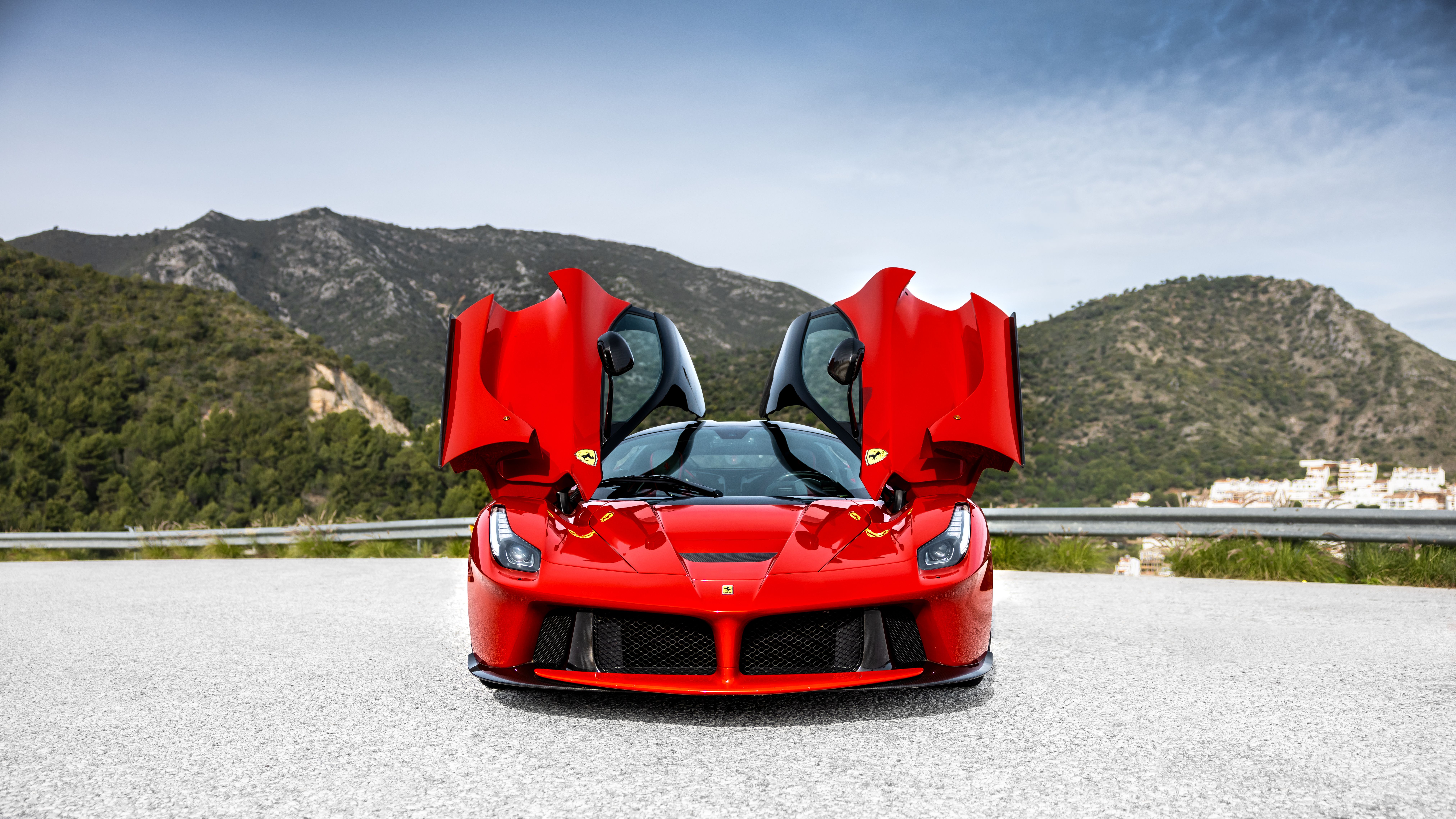 Red Ferrari LaFerrari with both doors open, front view